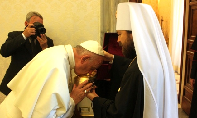 Pope kissing relics of St. Seraphim of Sarov, with Hilarion_Sept. 2016.jpg